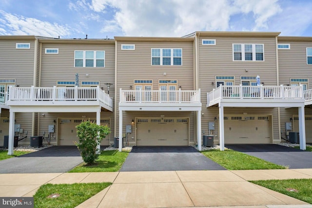 7916 Culloden Crest Ln, Gainesville, VA 20155 - rear view of property featuring an attached garage and asphalt driveway