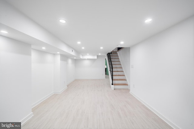 basement featuring light hardwood / wood-style flooring