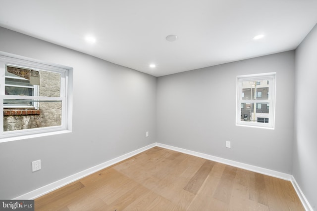 empty room with wood-type flooring