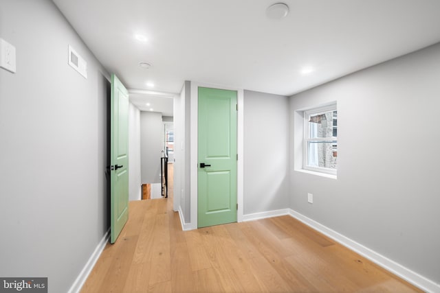 corridor featuring light hardwood / wood-style flooring