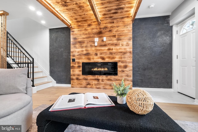 living room with wooden ceiling and light hardwood / wood-style floors