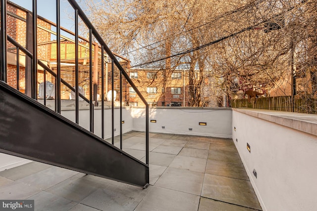 view of patio / terrace featuring fence