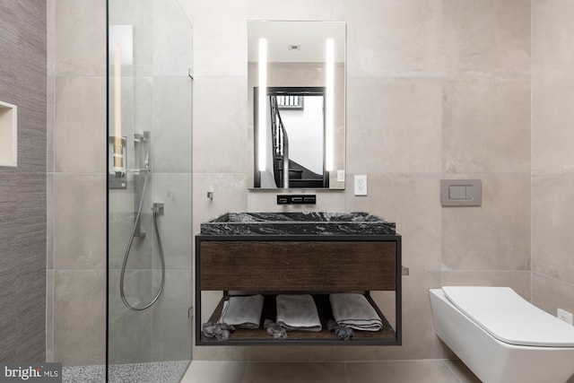 bathroom featuring toilet, vanity, walk in shower, and tile walls