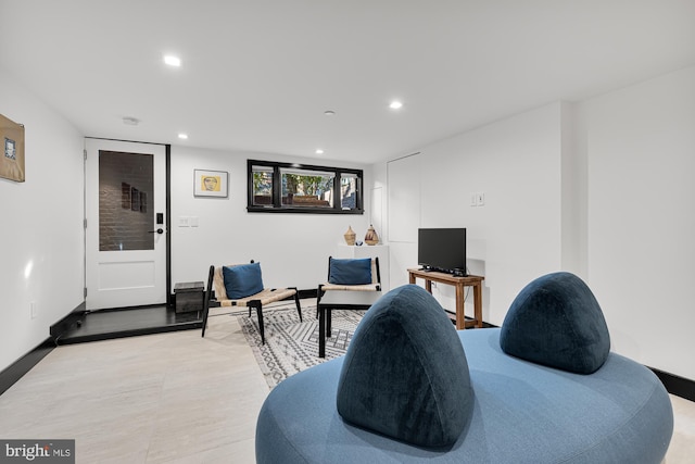 interior space featuring baseboards and recessed lighting