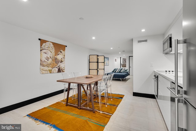 dining room featuring baseboards, visible vents, and recessed lighting