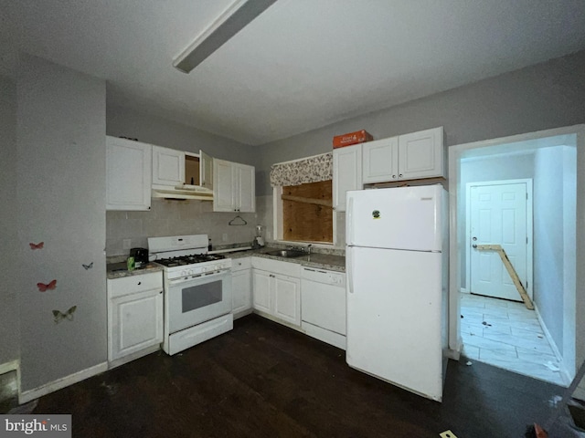 kitchen with white cabinetry, sink, and white appliances