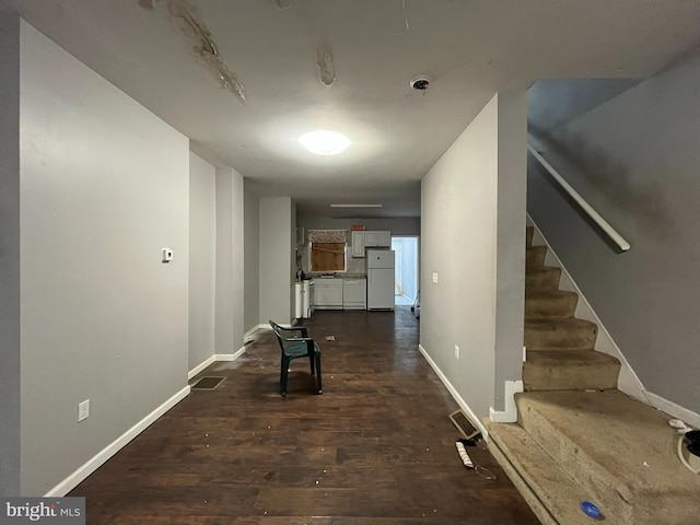 corridor with dark wood-type flooring