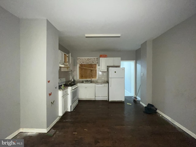 kitchen featuring white appliances and white cabinets