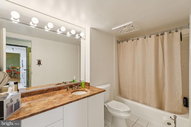 full bathroom with vanity, toilet, tile patterned flooring, and shower / bath combo