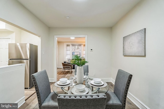 dining area featuring wood-type flooring