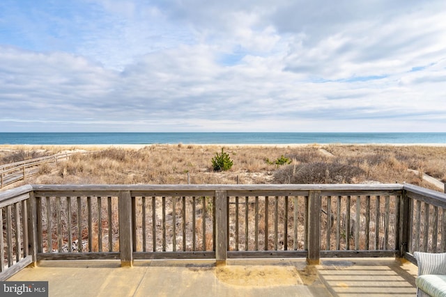 exterior space featuring a view of the beach and a water view