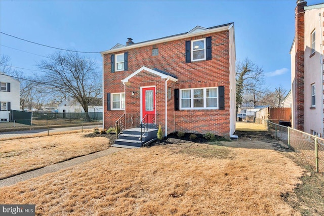 view of property featuring a front lawn