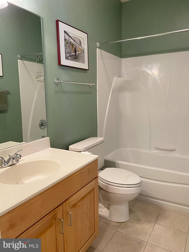 full bathroom with tile patterned flooring, vanity, shower / tub combination, and toilet