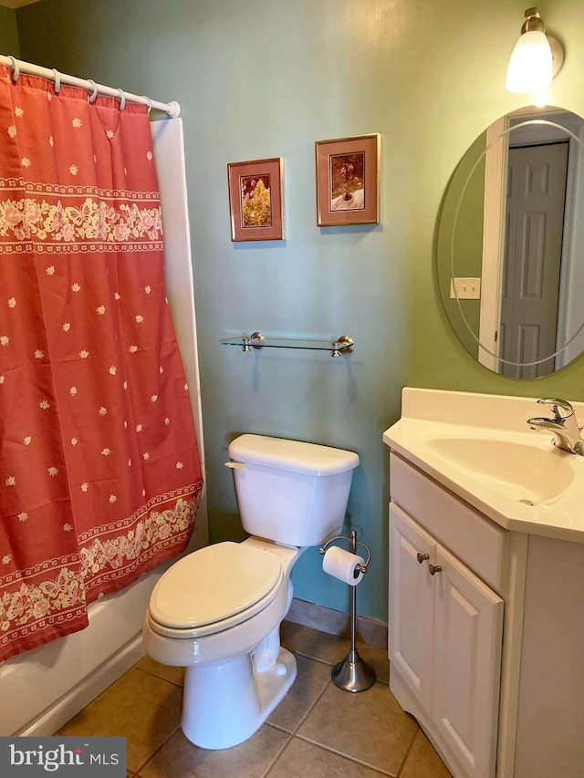 full bathroom with tile patterned flooring, vanity, shower / bath combo, and toilet