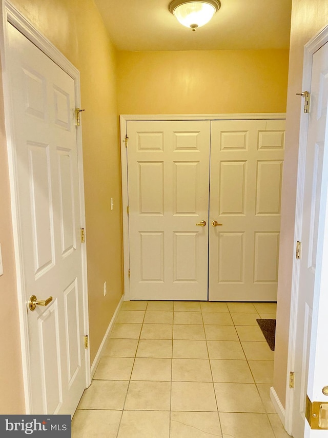 entryway featuring light tile patterned floors