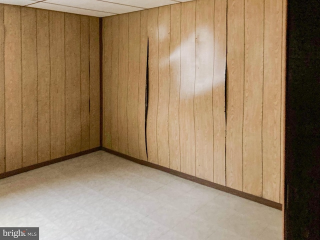 empty room with wood walls