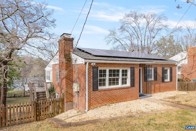 view of front of home with solar panels