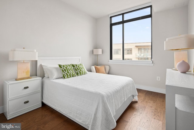 bedroom featuring dark hardwood / wood-style flooring