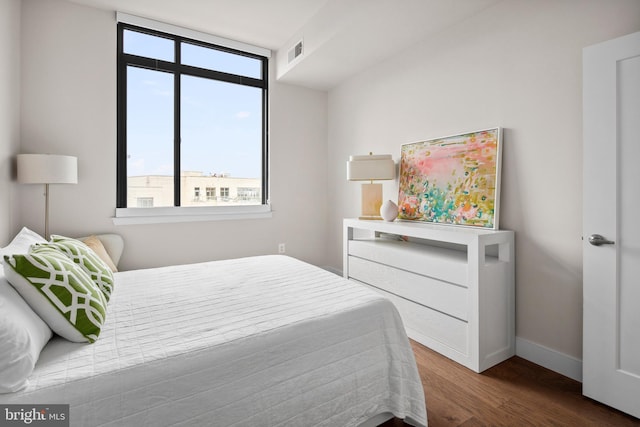 bedroom with hardwood / wood-style flooring