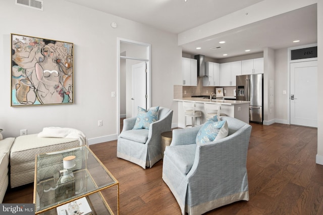 living room with dark hardwood / wood-style floors