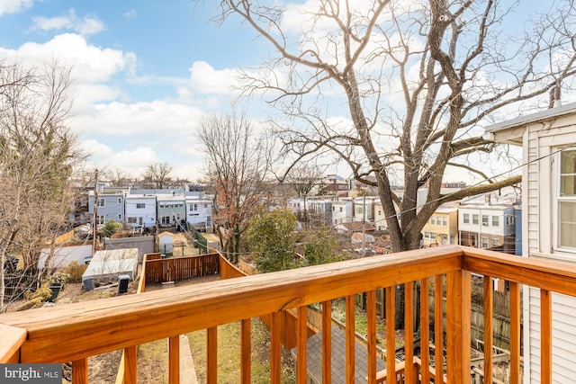 wooden terrace featuring a residential view