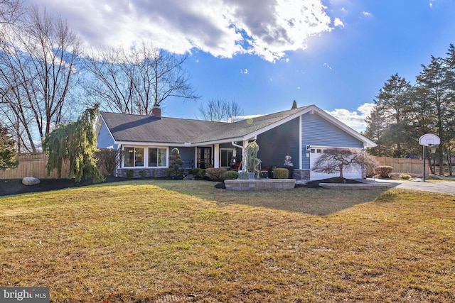 ranch-style home featuring a garage and a front yard