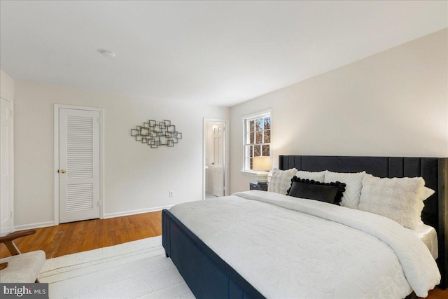 bedroom featuring wood-type flooring