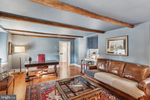 living room featuring wood-type flooring and beam ceiling