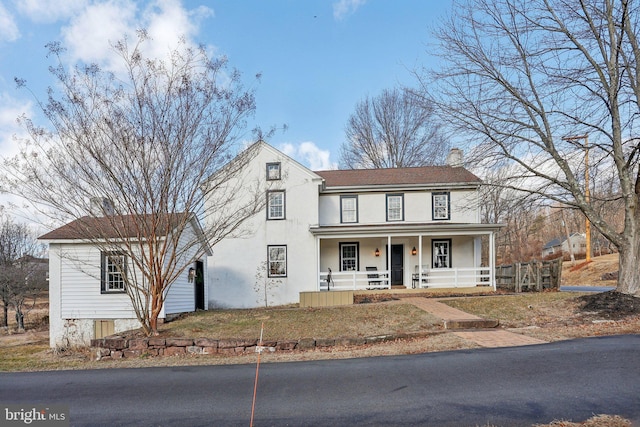 view of front of property featuring covered porch