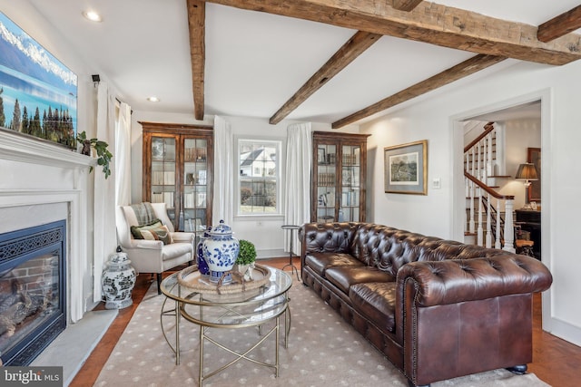 living room with beamed ceiling