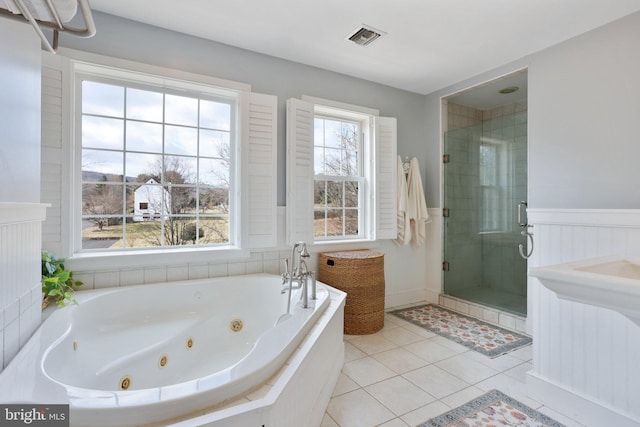 bathroom with plus walk in shower and tile patterned flooring