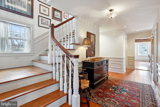 stairs featuring hardwood / wood-style flooring