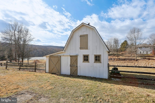 view of outbuilding with a lawn