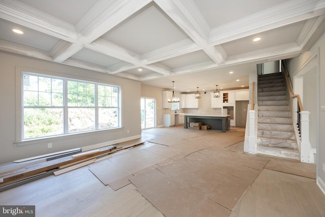 unfurnished living room with stairs, coffered ceiling, beamed ceiling, and recessed lighting