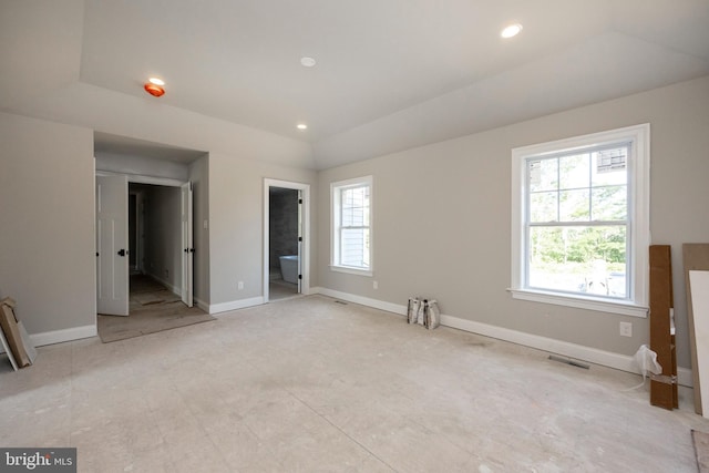 unfurnished bedroom featuring recessed lighting, visible vents, ensuite bath, and baseboards