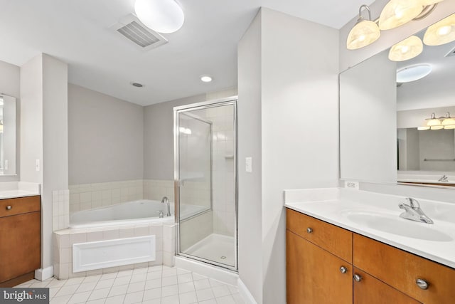 bathroom with a garden tub, tile patterned flooring, visible vents, and a stall shower