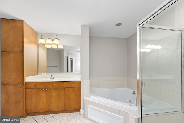 bathroom with a stall shower, vanity, a bath, and tile patterned floors