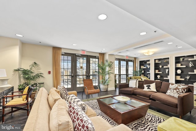 living room with recessed lighting, french doors, and wood finished floors