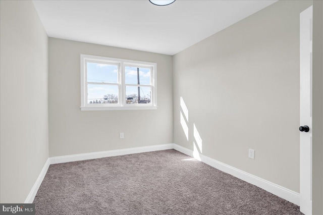 unfurnished room with carpet