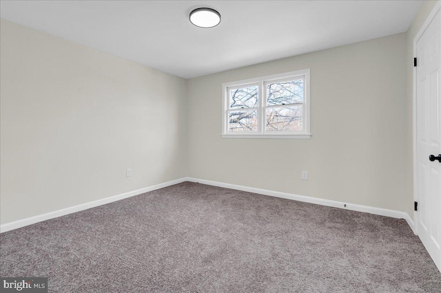 empty room with carpet flooring