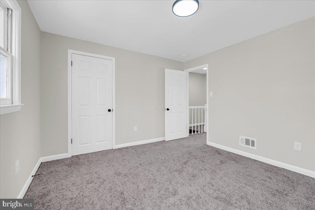 spare room featuring carpet flooring