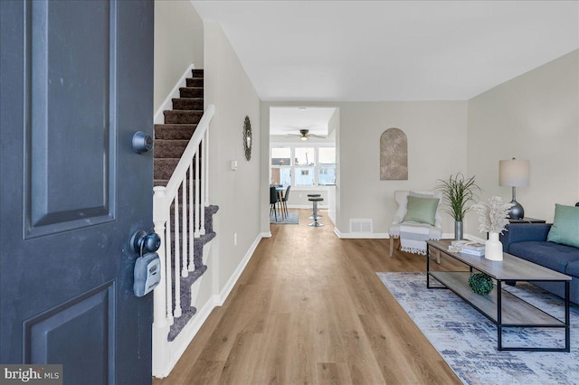 foyer entrance with hardwood / wood-style flooring