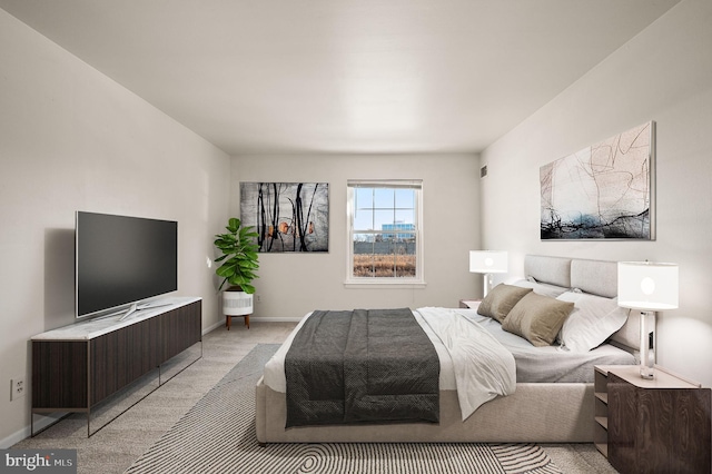 bedroom with light carpet