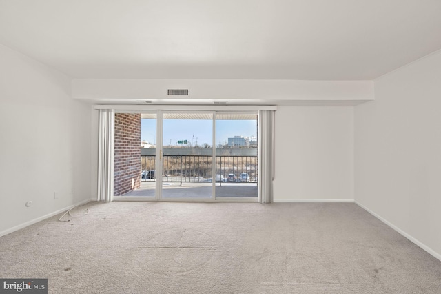 unfurnished room featuring carpet