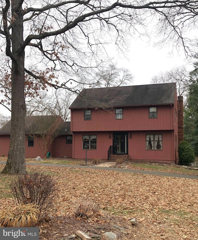 view of front of property featuring a chimney