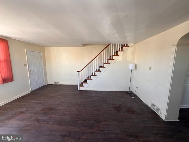 entryway with dark wood-type flooring