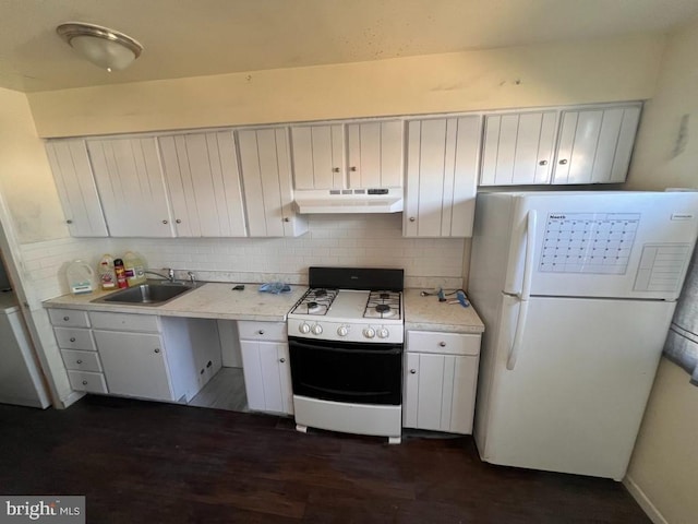 kitchen with white cabinetry, white appliances, sink, and tasteful backsplash