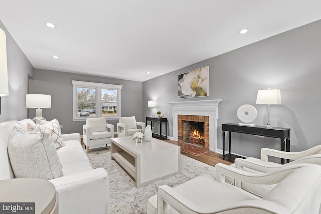 living room with a fireplace and light hardwood / wood-style flooring