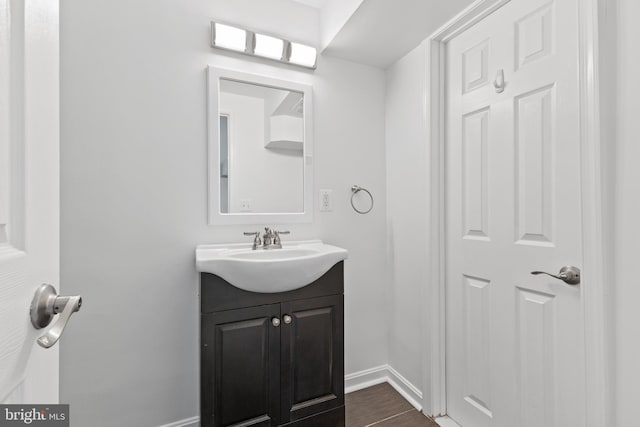 bathroom with vanity and hardwood / wood-style flooring