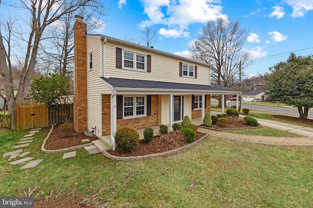 front of property with a front lawn and a porch